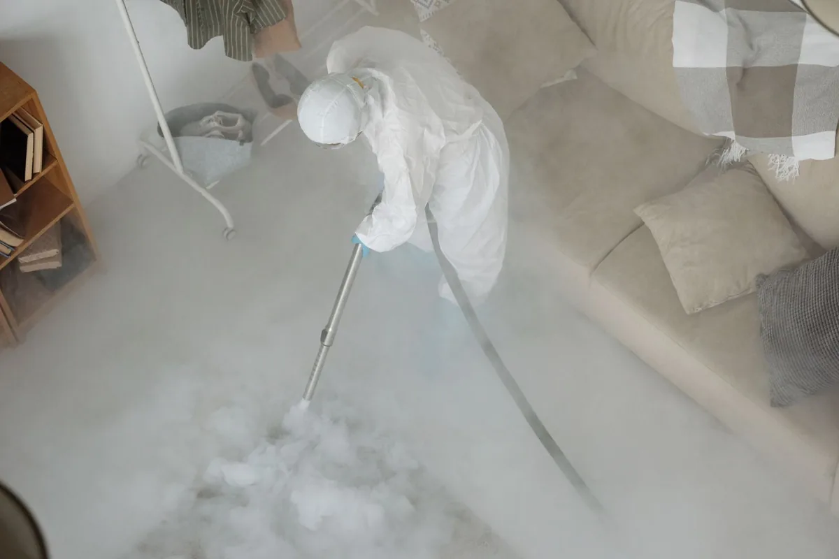 Biohazard cleanup technician in protective equipment, Belle Plaine, MN